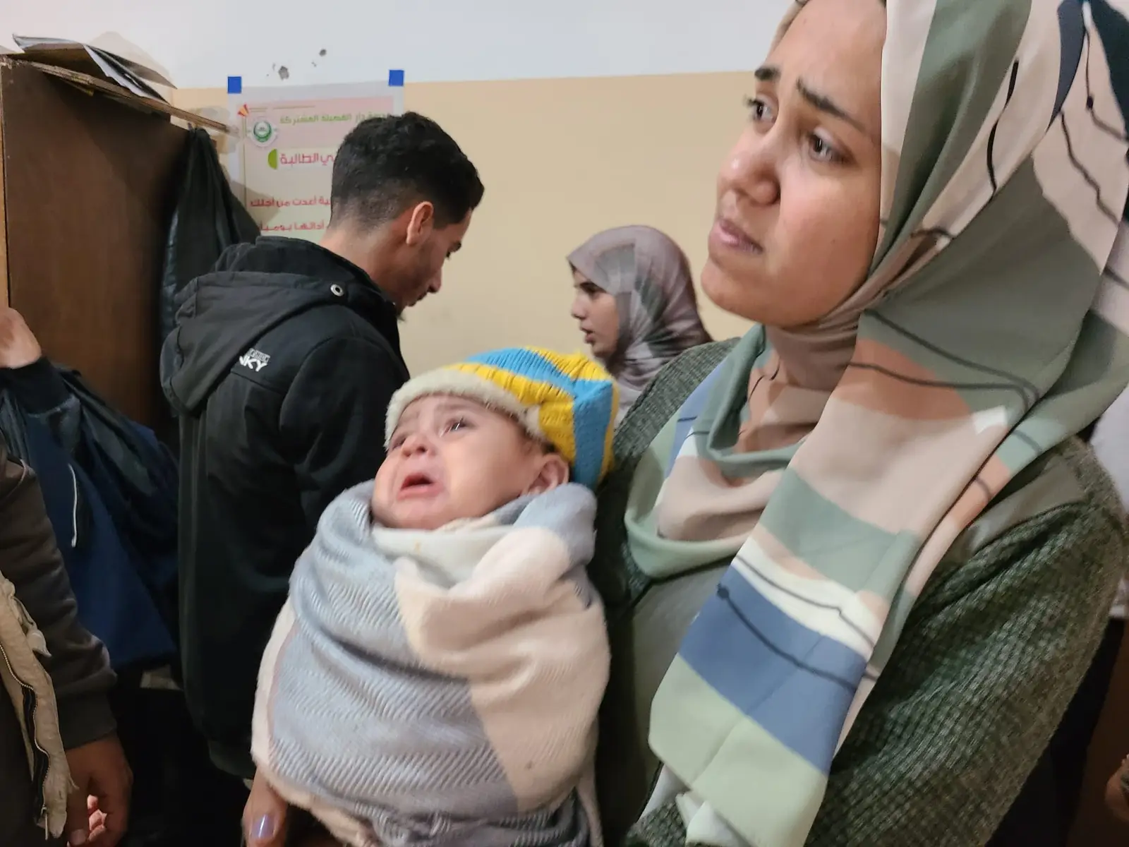 A woman holding a baby