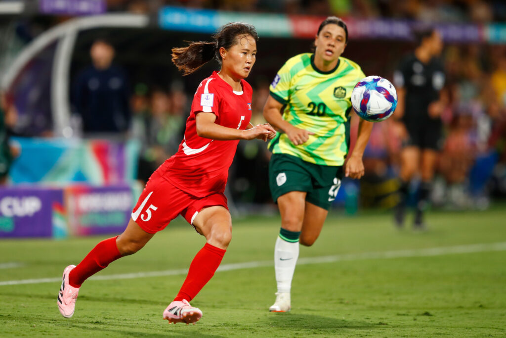 North Korea's An Kuk-Hyang, left, and Australia's Sam Kerr battle for the ball during the Women's Asian Cup quarterfinal soccer match between Australia and North Korea in Perth, Australia, Friday, March 13, 2026.